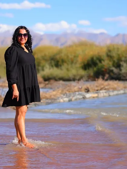 A participant enjoying the therapeutic feel of the cool river water against the backdrop of the mountains.