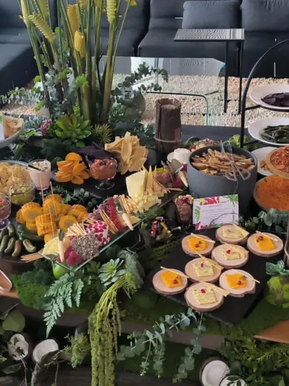 A lush and abundant grazing table, showcasing another of our service styles. Grazing tables are perfect for creating a relaxed, communal, and visually impressive focal point for an event.