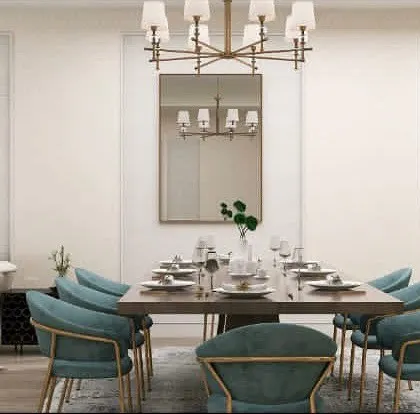 A view of the dining setup, showing the elegant chandelier and wall molding that add a classic touch to the modern design.