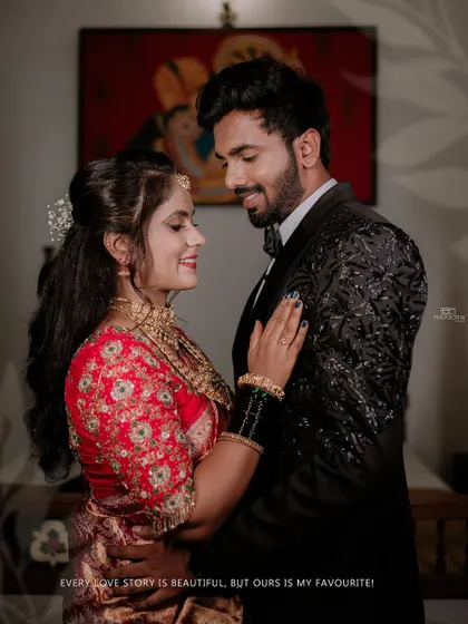 A classic indoor reception portrait of the couple.