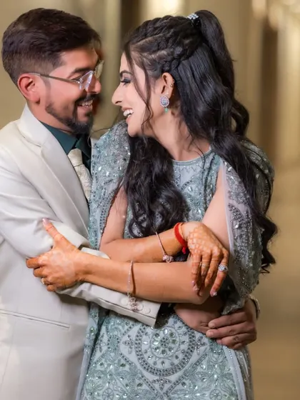 Laughter and love. This candid shot captures the pure joy and fun of the engagement celebration.