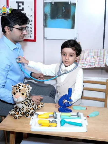 A father and son playing doctor in our pretend-play clinic. It's a wonderful way for parents to bond with their kids.