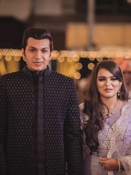 A classic black open Indo-Western jacket, elevated with subtle moti and katdana work. This outfit is designed for formal evening events where elegance is key.