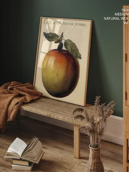 A print of Rene Magritte's famous surrealist piece, "This is not an apple." This thought-provoking artwork is a classic conversation starter, perfect for adding an intellectual and artistic touch to any room.