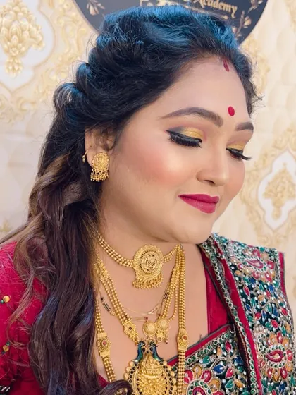 A side view of the festive makeup, highlighting the golden eyeshadow.