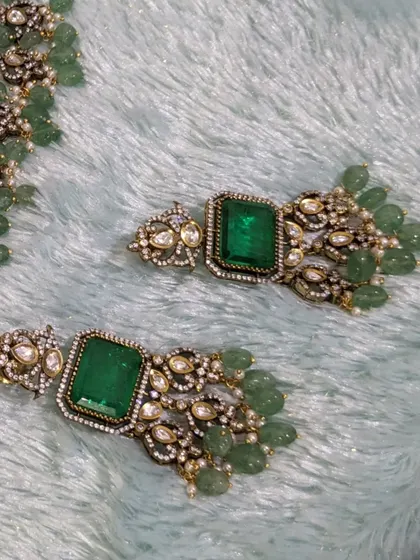 A close-up of the matching earrings, showing the quality of the stones and craftsmanship.