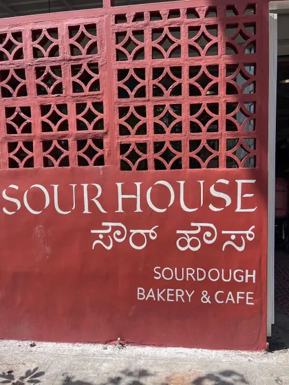 Typographic wall art is key for branding. This hand-painted sign for a sourdough bakery adds an organic, authentic touch to their entrance.
