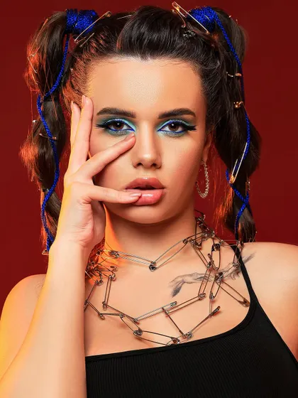 An edgy fashion concept using safety pins as jewelry and hair accessories. This is an example of how we can turn everyday objects into high-fashion art.