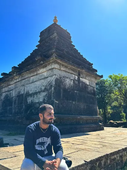 A moment of peace, sitting in front of an ancient stone temple. These are the times I connect with the history and spirituality of the places I visit.