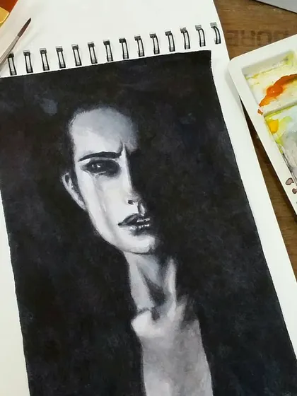 Here is the "Woman in the dark" painting in my sketchbook, next to the paint palette I used to mix the different shades of grey and black.