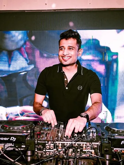 A smile of satisfaction while mixing at Mobe 26. The visuals behind me are always synced to the music, creating a cohesive and immersive experience.