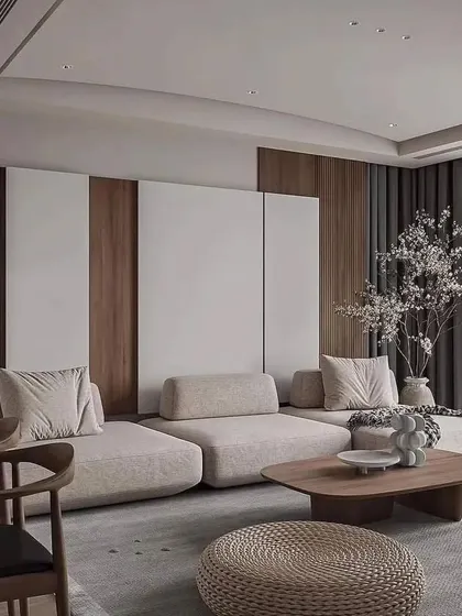 A view of the living room's feature wall, which uses a combination of white and wood panels to create a modern and textured backdrop.