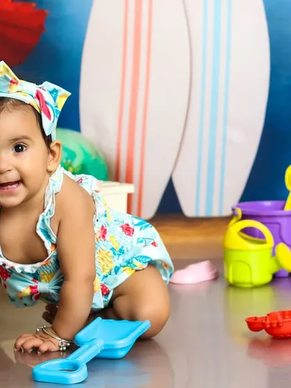 This little crawler is exploring the "sandy" shore in our beach-themed studio. A great shot to capture a baby on the move.