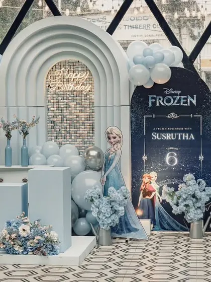 Let it go! This magical Frozen-themed birthday party features Elsa and Olaf, with a wintery blue and white color palette, balloon clouds, and custom backdrops creating the kingdom of Arendelle.