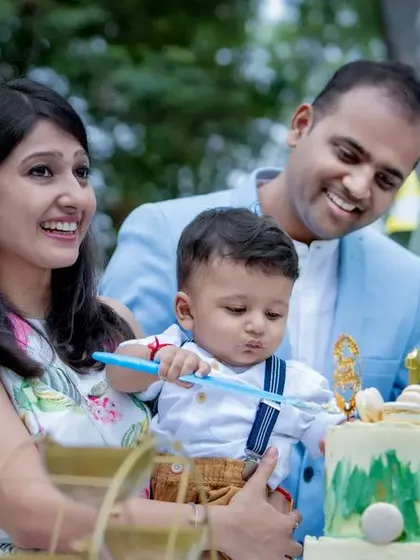 Capturing the magic of your very first birthday. The whole family joins in for the cake cutting celebration.