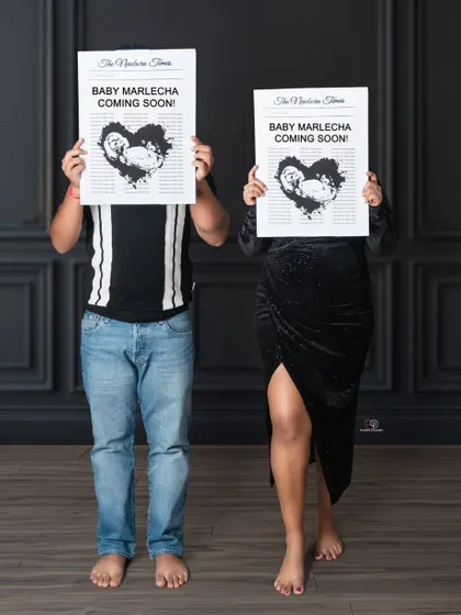 A playful and anonymous baby announcement! Using the custom newspaper to hide their faces adds a touch of mystery and fun to this couple's maternity photo.