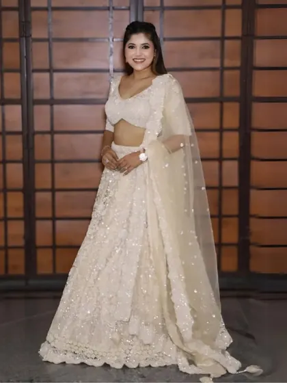 Looking for an outfit for a sangeet or reception? This beautiful off-white sequin lehenga is a versatile and glamorous option for any wedding event.