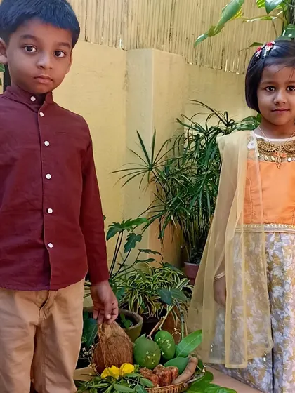 A brother and sister posing by the Ugadi platter.