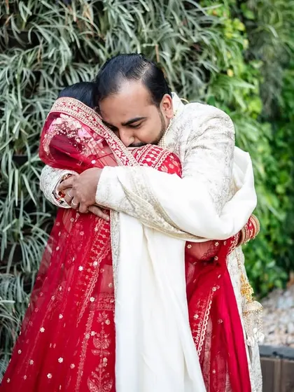 A powerful, emotional hug between the bride and groom during their 'first look'. A moment of pure love and relief.