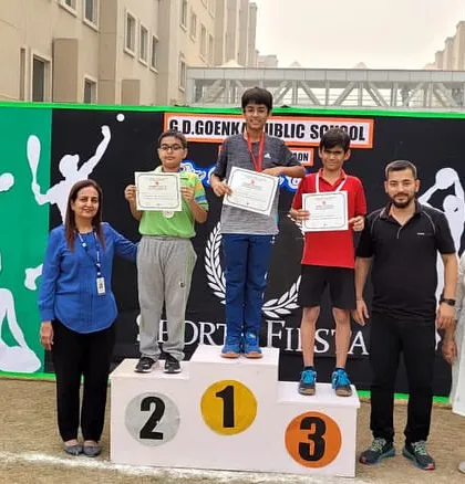 Laksh Malik on the winner's podium, taking the number one spot at the GD Goenka School's Sport Fiesta. Moments like these make all the hard work worthwhile for students, parents, and coaches.