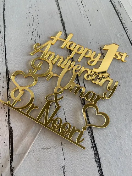 A flat lay of the "Happy 1st Anniversary" topper, allowing a clear view of all the design elements.