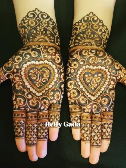 A perfect design for a bridesmaid or sister of the bride. This symmetrical pattern features a beautiful heart motif, filled with intricate details and delicate swirls. It’s a full-hand design that is both elegant and celebratory.