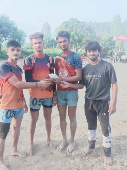 Players with their cash prize after securing 1st place in a local competition.