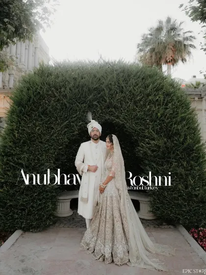 Anubhav and Roshni's wedding in Istanbul was a fairytale. This portrait, set against the perfectly manicured gardens and historic architecture of the Ciragan Palace, captures the timeless elegance of their celebration.