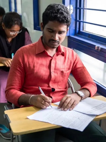 A student focused during a written examination. Our certification process is thorough and prepares learners for international language tests.