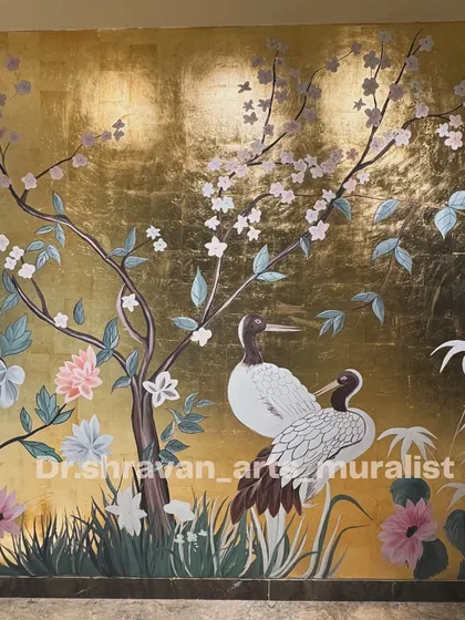This mural is inspired by traditional Chinese art, featuring cranes and cherry blossoms against a full wall of shimmering gold lustre. It's a statement of pure elegance and luxury.