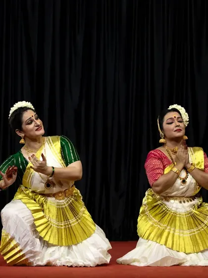 Two dancers in a moment of prayerful offering, from our duet choreography presented at Guruvayur.