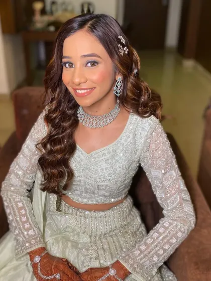 The perfect smile to go with the perfect glow. This close-up shows the seamless blend of the makeup, creating a look that is both stunning and natural.