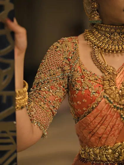 A collection of detailed shots focusing on the diverse and intricate embroidery of my custom blouses. These images highlight the fine craftsmanship, luxurious materials, and unique designs that define my work.