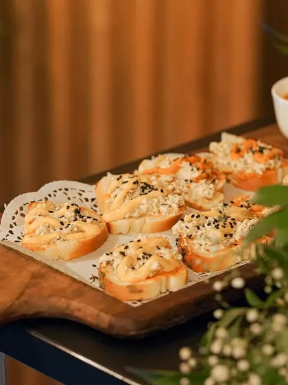 My take on bruschetta, featuring a creamy chicken topping on toasted bread, garnished with black sesame seeds. It's a simple, elegant, and flavorful appetizer.