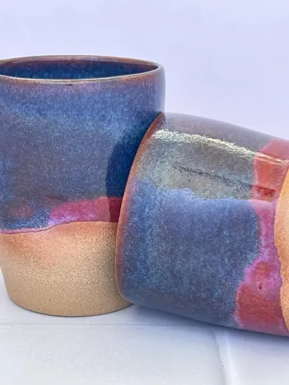 The warm, sandy color of the unglazed stoneware contrasts beautifully with the rich, glossy glaze.