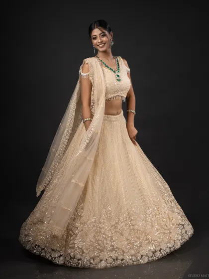 A full-length portrait showcasing an elegant, embroidered lehenga. My ethnic wear photoshoots focus on the beautiful details of the garment and the model's poise.