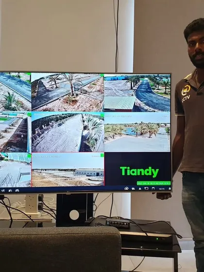 A proud client moment with his new large-screen monitoring setup. This screen shows feeds from his extensive Tiandy PTZ camera system.