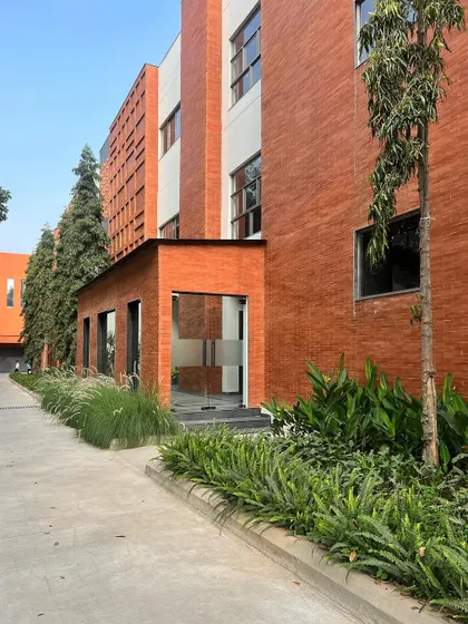 This 40,000 sq ft office building features a striking terracotta brick facade. We integrated lush landscaping along the exterior to soften the structure and create a seamless connection between the building and its natural surroundings.
