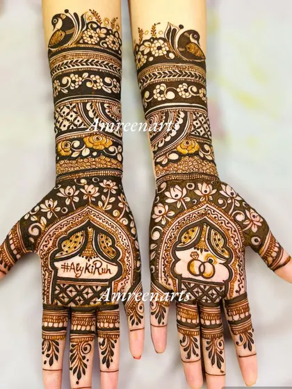 Your wedding hashtag becomes a permanent memory. This engagement design features the hashtag #AlyKiRuh and interlocking rings, framed by intricate patterns.