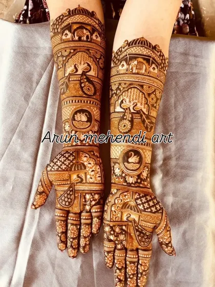 This design is filled with a variety of auspicious symbols, including elephants, peacocks, swans, and a doli.