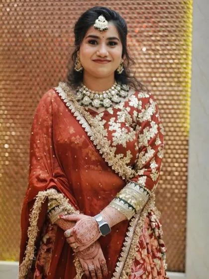 A close-up of the client's makeup and jewelry.