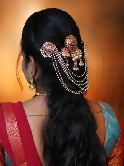 Another view of the simple yet stunning Jadau hair accessory, perfect for a half-updo or a ponytail.