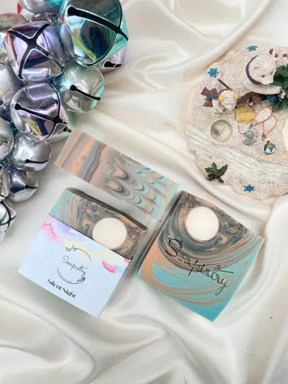 The Silent Night soap, with its calming colors and a moon embed, captures the peace of a winter's night.