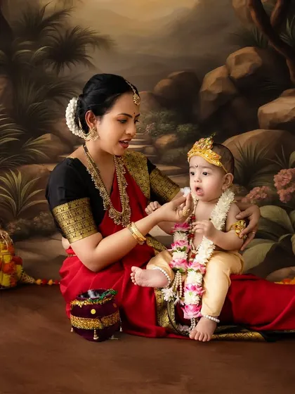 A quiet, intimate moment as a mother shares a snack with her little Krishna.
