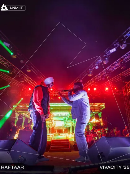 Raftaar owning the stage at Vivacity '25, LNMIIT. The dynamic lighting with red and green hues was programmed by my team to match the intensity of his set.