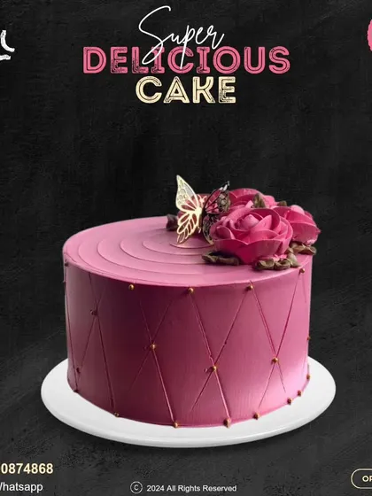 A sophisticated magenta cake with a geometric quilted pattern. This design is topped with beautiful buttercream roses and a delicate golden butterfly for a touch of elegance.
