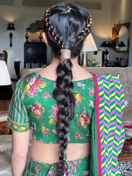 The full view of this impressive braid, showing its length and the beautiful pattern created by the colorful threads. This is an advanced technique that makes a huge impact.