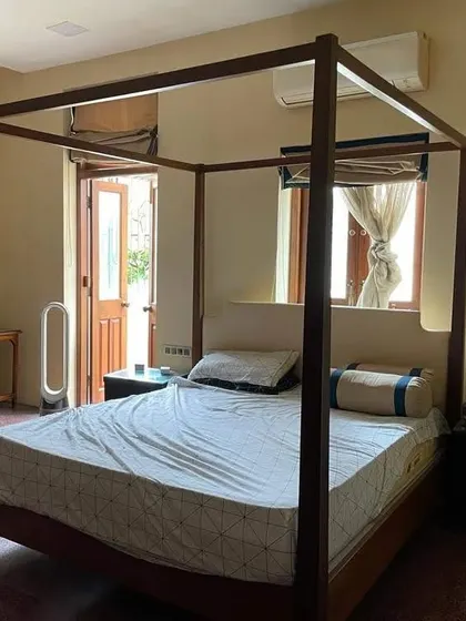 A simple and elegant four-poster bed frame installed in a client's home. This minimalist take on the classic design works well in modern as well as traditional interiors.