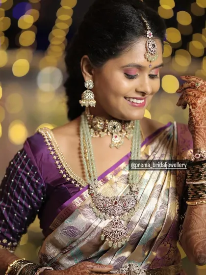 A happy, smiling shot of the client. The soft, romantic makeup pairs beautifully with the unique color and design of the jewellery.