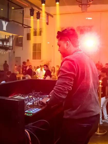 A shot from behind the decks during a busy night. I focus on the music and the crowd to create an immersive experience.